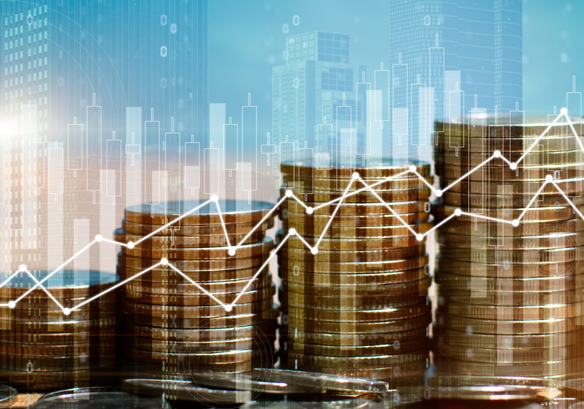 Stacks of coins with financial graph overlay.